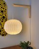 Sphere M + L shape sconce - modern wall lamp + origami shade | Sconces by Studio Pleat. Item made of wood with paper works with minimalism & contemporary style