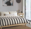 Black & Cream Striped Throw Blanket & Bed Spread | Linens & Bedding by Lumina Design. Item composed of cotton in mid century modern or contemporary style