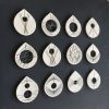 Stitched Ceramics - Set Of 12 | Wall Sculpture in Wall Hangings by Elizabeth Prince Ceramics. Item composed of stoneware compatible with mid century modern and contemporary style