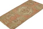 Vintage Turkish Rug in Pink and Cream with Geometric Medalli | Area Rug in Rugs by Rug and Kilim