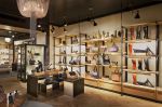 Perimeter Shelving System | Storage by Amuneal | Cole Haan in New York. Item composed of wood and metal