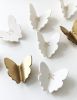 Set of 11 Gold & White Porcelain Ceramic Butterflies | Wall Sculpture in Wall Hangings by Elizabeth Prince Ceramics. Item composed of stoneware in minimalism or contemporary style