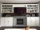 Cement and wood fireplace wall | Fireplaces by Kula Solutions. Item composed of wood and cement