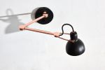 Laito Mini Wall Sconce L | Sconces by SEED Design USA. Item made of steel