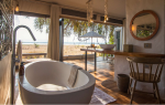 Studio Stirling Nest Eggs at Chikwenya Camp in Zimbabwe | Swing Chair in Chairs by Studio Stirling. Item made of steel works with minimalism & coastal style