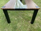 Contemporary steel and walnut dining table | Tables by Aaron Smith Woodworker. Item composed of walnut and brass in contemporary or eclectic & maximalism style