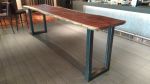 Solid Black Walnut Slab Table | Dining Table in Tables by DI VITA Style | IPIC Theaters in Redmond. Item made of walnut with steel