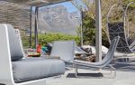 Studio Stirling Circular Wheel Chair in the POD Hotel | Swing Chair in Chairs by Studio Stirling | POD Camps Bay in Cape Town. Item composed of steel in minimalism or contemporary style