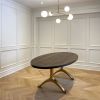 Oval Charcoal Walnut Brass Wishbone Table | Dining Table in Tables by YJ Interiors. Item composed of walnut and brass in mid century modern or contemporary style