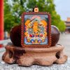 Artisan Manjushri Thangka Ash Clay Buddhist Amulet Pendant | Ornament in Decorative Objects by Dynasty Artisan. Item made of leather compatible with contemporary and eclectic & maximalism style