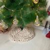 Knitted Christmas tree skirt in champagne color | Small Rug in Rugs by Anzy Home. Item composed of cotton