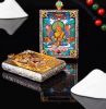 Handcrafted Yellow Zambala Thangka Pendant Garuda Amulet Art | Ornament in Decorative Objects by Dynasty Artisan. Item composed of metal compatible with contemporary and eclectic & maximalism style