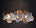 Limpets Bar 3 | Pendants by Fragiskos Bitros. Item composed of wood and metal