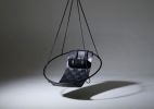 Genuine Leather Woven into a Hanging Swing Chair | Accent Chair in Chairs by Studio Stirling. Item made of steel & leather compatible with boho and minimalism style