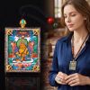 Handcrafted Yellow Zambala Thangka Pendant Garuda Amulet Art | Ornament in Decorative Objects by Dynasty Artisan. Item composed of metal compatible with contemporary and eclectic & maximalism style