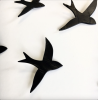 Set of 20 black porcelain ceramic bird wall artwork | Wall Sculpture in Wall Hangings by Elizabeth Prince Ceramics. Item composed of ceramic in minimalism or mid century modern style