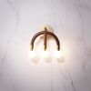 Wall Mount Light CROWN | Sconces by HACHI COLLECTIONS | Ginza Brasserie Grand Bleu in Chuo City. Item made of walnut with brass
