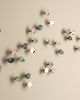 Titled "The Softness," porcelain ceramic petal sculpture | Wall Sculpture in Wall Hangings by Elizabeth Prince Ceramics. Item composed of metal and ceramic in contemporary or japandi style