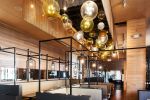Bubble | Chandeliers by Illuminata Art Glass Design by Julie Conway | Din Tai Fung in Bellevue. Item made of brass & glass