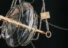 Trapezi Chandelier Three Lights | Chandeliers by SilvioMondinoStudio | ممشى مارينا دبي in دبي. Item composed of linen & brass