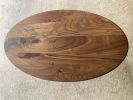 Oval Walnut coffee table | Tables by Kindred Furniture. Item made of walnut & steel compatible with mid century modern and contemporary style