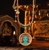 Premium Hand-Painted Green Tara Bodhi Leaf Thangka Pendant | Ornament in Decorative Objects by Dynasty Artisan. Item made of metal works with contemporary & eclectic & maximalism style