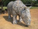 The Migration of the Rhinoceros - Jui-Yen | Public Sculptures by Roger Gaudreau | Muar Chung Hwa High School in Muar. Item composed of metal and stone
