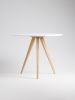 Round white table, dining table, with solid oak legs | Tables by Mo Woodwork. Item composed of oak wood in minimalism or mid century modern style