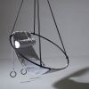 Soft Leather Swing in Santorini, Greece | Easy Chair in Chairs by Studio Stirling | Abyss Santorini in Oia. Item made of steel with leather works with boho & art deco style