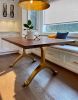 Black walnut dining table with brass wishbone legs | Tables by YJ Interiors. Item made of walnut with brass works with mid century modern & contemporary style