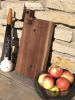 Live Edge Black Walnut Board with circle inlays | Serveware by Patton Drive Woodworking. Item composed of walnut