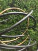 Gold in Black Tall Spiral | Public Sculptures by Mark Beattie MRSS | 45 Park Lane in London. Item made of copper
