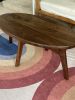 Oval Walnut coffee table | Tables by Kindred Furniture. Item made of walnut & steel compatible with mid century modern and contemporary style