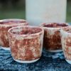 Shino Chai Gloss Set of Sake Bottle and 5 Cups | Bar Accessory in Drinkware by Hiraeth Ceramics. Item made of stoneware works with contemporary & modern style