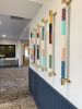 Vertical Painted Ropes | Wall Sculpture in Wall Hangings by Cassandra Smith | Triton Square Apartments in Groton