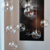 Glass Bubbles Chandelier with 34 Clear Pendants in a Cluster | Pendants by Galilee Lighting. Item composed of metal & glass compatible with minimalism and modern style