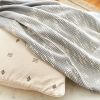 FLO Grey Throw | Linens & Bedding by Studio Variously. Item composed of fabric compatible with modern style