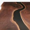 Custom Resin River Walnut Dining Table | Tables by Elko Hardwoods. Item composed of wood & steel