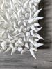 White spikes clay wall sculpture on a 20" square canvas, abs | Sculptures by Natasha Kanevski. Item made of canvas & ceramic compatible with contemporary style
