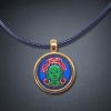 Premium 2cm Green Tara Thangka Sacred Relic Pendant Art | Ornament in Decorative Objects by Dynasty Artisan. Item composed of metal compatible with contemporary and eclectic & maximalism style