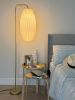 Gold floor lamp with a pleated oval long lampshade | Lamps by Studio Pleat. Item made of brass with paper works with minimalism & contemporary style