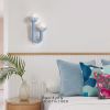 Baby Blue Sculptured Sconces with Glass bubbles | Sconces by Light and Fiber. Item made of steel with glass works with mid century modern & contemporary style
