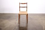 Carved Wood Dining Chair with Woven Rush Seat by Costantini | Chairs by Costantini Design. Item composed of oak wood