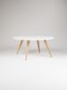 FINN 4 - White round coffee table, with solid oak legs | Tables by Mo Woodwork | Stalowa Wola in Stalowa Wola. Item made of oak wood works with minimalism & mid century modern style