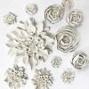 Porcelain Flowers Artwork, Set of 10 | Wall Sculpture in Wall Hangings by Maap Studio | The Candler Hotel Atlanta, Curio Collection by Hilton in Atlanta. Item composed of ceramic in contemporary or country & farmhouse style