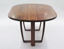 Oval walnut table, Trapeze leg, with book-matched top. | Dining Table in Tables by Jonathan Field. Item composed of walnut