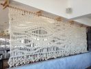 Extra Large Rope Room Divider Wall Hanging & Macramé Screen | Macrame Wall Hanging in Wall Hangings by MACRO MACRAME by Maeve Pacheco | Gurney's Montauk Resort & Seawater Spa in Montauk. Item made of wood with cotton works with contemporary & eclectic & maximalism style
