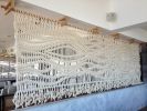 Extra Large Rope Room Divider Wall Hanging & Macramé Screen | Wall Hangings by MACRO MACRAME by Maeve Pacheco | Gurney's Montauk Resort & Seawater Spa in Montauk. Item made of wood with cotton works with contemporary & eclectic & maximalism style