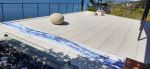 Mosaic patio inlay suggesting a river | Public Mosaics by JK Mosaic, LLC. Item made of stone