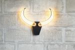 Bull Skull wall light | Sconces by Next Level Lighting. Item composed of wood and metal